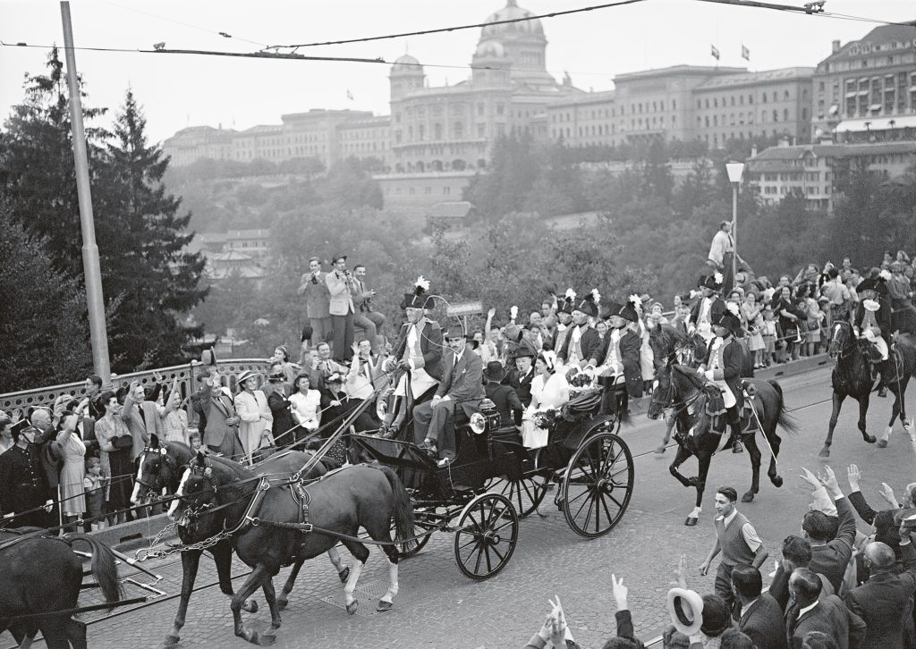 Historically-dressed cavalrymen escort the Churchill party through the Swiss capital of Bern