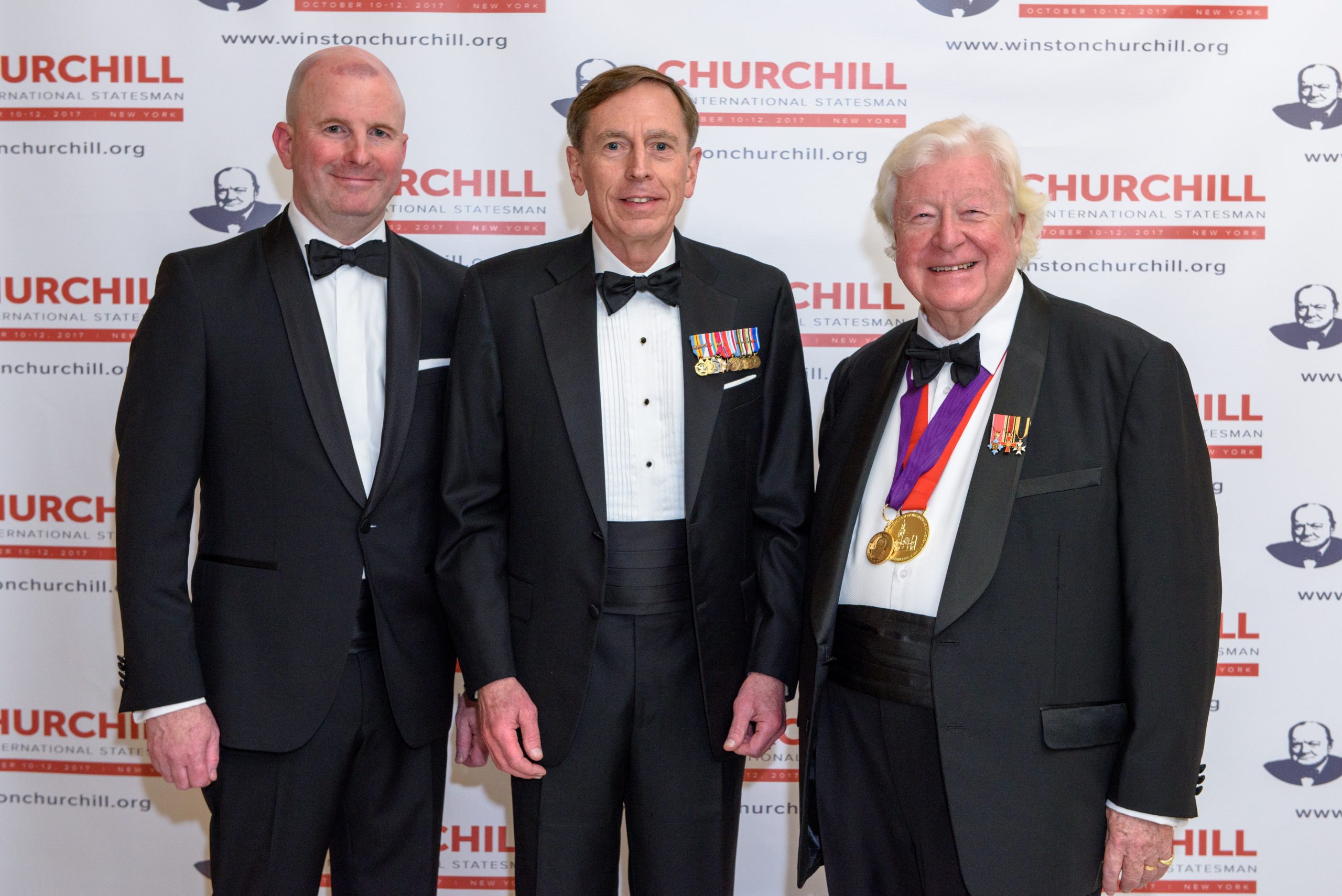 International Churchill Society Executive Director Michael F. Bishop is joined by Gen. David Petraeus and Lord Watson at the 2017 ICS Conference in New York.