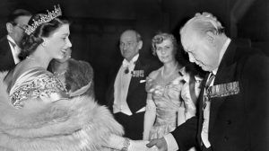 Churchill greets the Queen, while Clement Attlee and his wife Violet look on